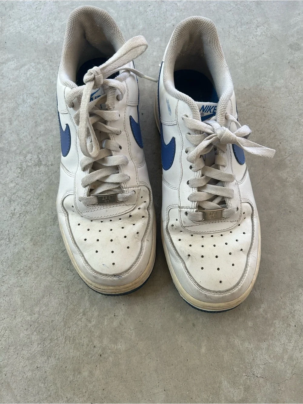 Nike White Sneakers with Blue Swoosh